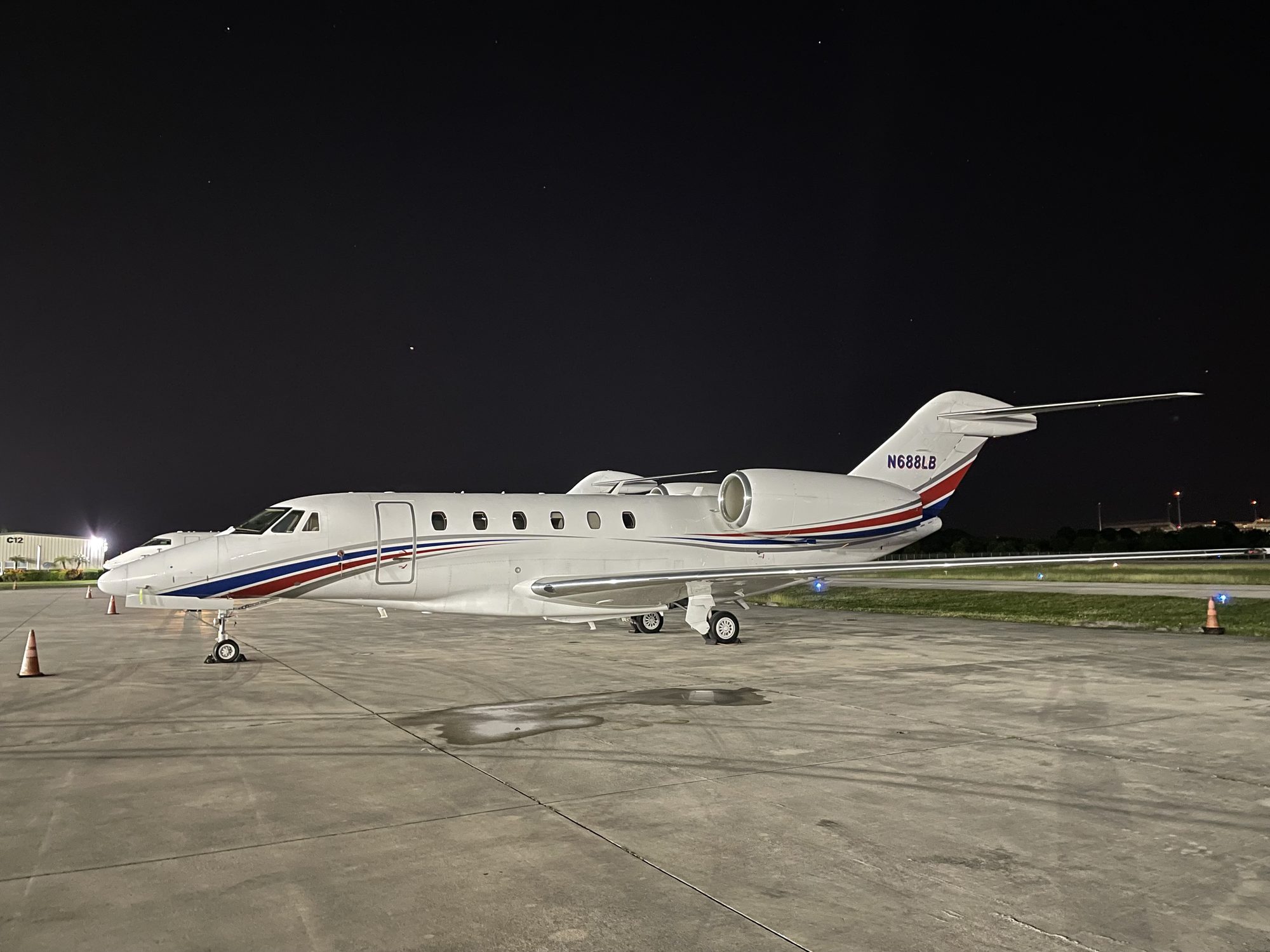 Business jet on the ramp at night, private jet tax write-off through charter placement